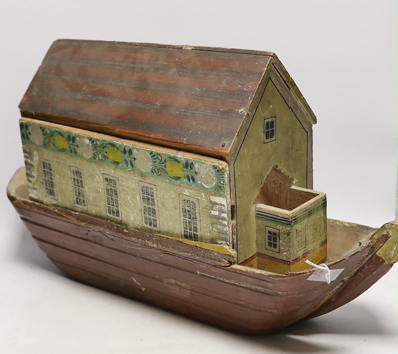 A mid 19th century Swiss or German Noah's Ark for restoration (incomplete), containing a selection of carved wooden animals, 69cm long, 32cm high